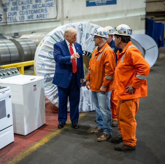 President Trump talking with workers in hard hats President Trump talking with workers in hard hats